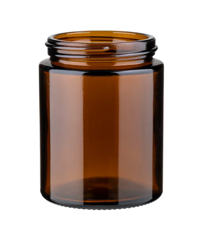 Leerer brauner Glastiegel als schützende Kosmetikverpackung